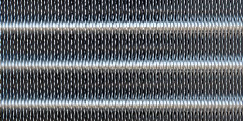 Air conditioning unit condenser coils fins